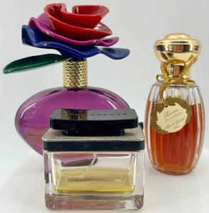 lot 112 image: Set of 3 Designer Perfume Bottles - Marc Jacobs Lola, Marc Jacobs, and Annik Goutal Passion