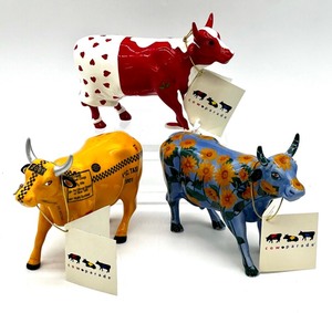 lot 163 image: Set of 3 CowParade Collectible Figurines NYC Taxi, Sunflowers, Udder Romance