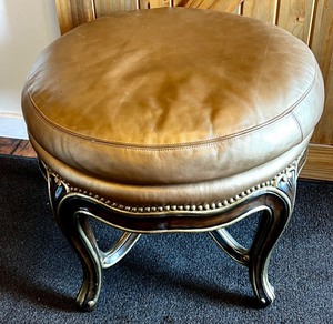 lot 165 image: Marge Carson Round Leather Ottoman with Decorative Wood Base