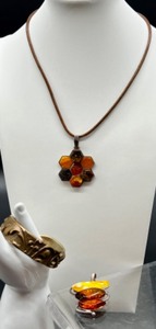 lot 133 image: Sterling Silver Amber Pendants with Necklace, Pendant and Artisan Crafted Brass Cuff Bracelet Lot