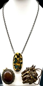 lot 134 image: Group of 3 Jewelry Pieces Handmade Dandy Statement Necklace, Ornate Brown Cabochon Pendant, Bergamot Brass Works 1976 Horse Head Belt Buckle
