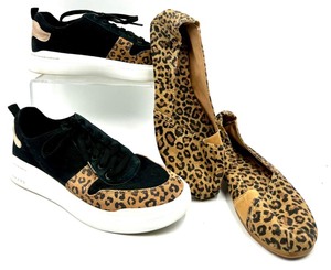 lot 140 image: Cole Haan Leopard Accent Lace-Up Sneakers and Mad Love Leopard Flats
