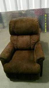 lot 13 image: Rotating Brown Rocker Recliner