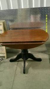 lot 61 image: Deep Brown Round Leaf Table