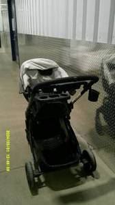 lot 65 image: Black Running Stroller