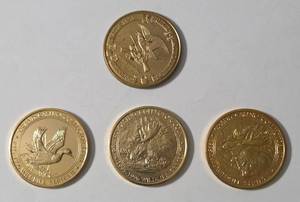 lot 27 image: 3 Casino Grand Commemorative Coins and 1 NRA Commemorative Coin