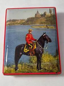 lot 42 image: Thornes World Premier Toffee Candy Advertising Tin from Leeds England, Canaidian Mounted Police 7 x 5.5 - from the 70s