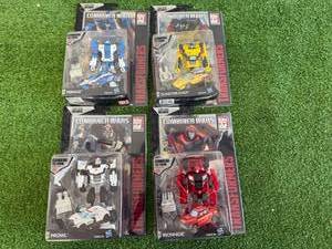 lot 22 image: Transformers Combiner Wars Mirage, Sunstreaker, Prowl & Ironhide