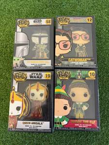 lot 196 image: Funko POP Pins - Queen Amidala, The Mandalorian, Catwoman & Buddy The Elf