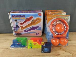 lot 212 image: Assorted Toys Dinosaur Launch Set, Squirt Guns, Basketball Hoops, Fidget Sphere - Brand New