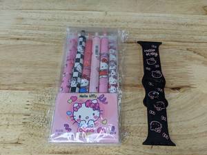 lot 252 image: 6 Hello Kitty Pens and Hello Kitty Apple Watch Band - Brand New