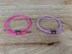 lot 301 image: 2 Adjustable H Buckle Bracelets Pink and Purple - Brand New