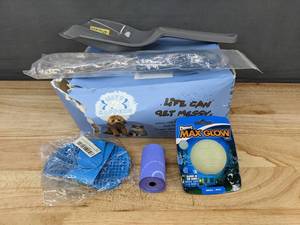 lot 368 image: Pet Care 17 Pads, Toys, Litter Scoop, Brushes, and Bags - Brand New
