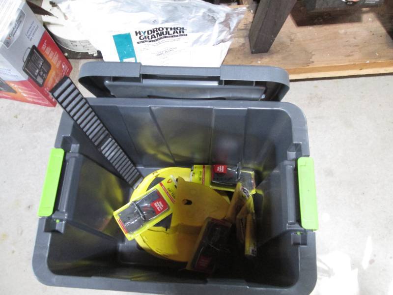 lot 317 image: Durable storage tote containing rod...
