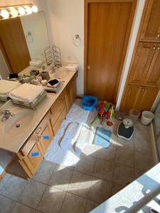 lot 89 image: Bathroom Supply Lot Towels, Bath Mats, Waste Cans, Soap Dispensers, and More