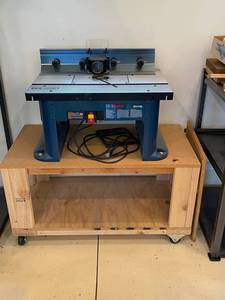 lot 12A image: Bosch RA1181 Router Table w Craftsman Router and Rolling Workstation