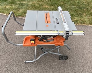 lot 10 image: Ridgid R4513 10-Inch Table Saw with Gravity Folding Wheel Stand