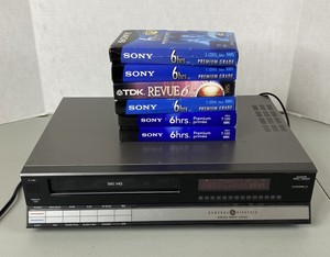 lot 21 image: Vintage General Electric VHS Player 9-7100 with 6 Blank Tapes