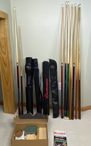 lot 39 image: Billiards lot with 9 pool cues, 4 cases, repair accessories and rules book