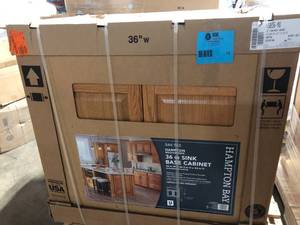 lot 12 image: Hampton Bay Hampton 36 in. W x 24 in. D x 34.5 in. H Assembled Sink Base Kitchen Cabinet in Medium Oak    Customer Returns See Pictures