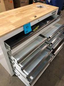 lot 61 image: Husky Tool Storage 46 in. W x 18 in. D 9-Drawer Gloss White Mobile Workbench Cabinet damage dent on bottom back customer return see pictures