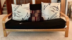 lot 19 image: Wood Frame Futon Couch with Black Cover and Pillows