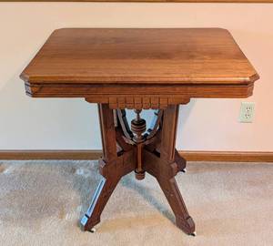 lot 6 image: Carved Walnut Eastlake Parlor Table