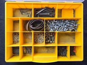 lot 28 image: Organizer Box with Assorted Nails, Bolts, Screws, and Sandpaper Rolls