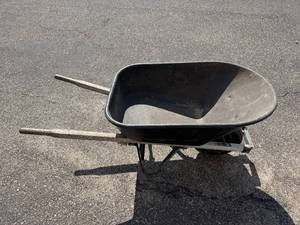 lot 60 image: Used Single-Wheel Garden Wheelbarrow with Wooden Handles