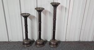 lot 112 image: Set of Tall Ribbed Metal Candle Holders