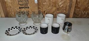 lot 114 image: Assorted Drinkware Set Tiki Glasses, Coffee Mugs, Plates, and Creamer Pitcher