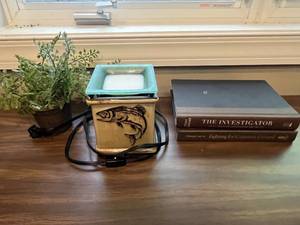 lot 197 image: Decorative Fish Motif Electric Wax Warmer, Faux Plant, and 2 Hardcover Books Set