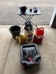 lot 260 image: Garage Oil Change and Fluid Supplies Lot with Funnel, Gas Cans, Buckets, and More - content quantities unknown