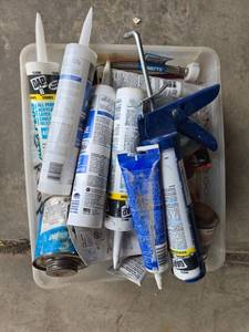 lot 279 image: Assorted Plumbing Supplies with Caulk, Sealants, and Tools