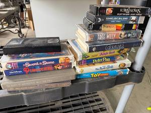 lot 301 image: Collection of Classic Disney VHS Tapes and Books