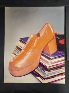 lot 87 image: Collection of Vintage Prints Featuring Shoes, Typewriter, and Stamps