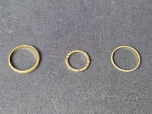 lot 100 image: Set of 3 Gold Tone Rings, Sizes 4, 10.5, and 11.5