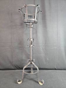 lot 215 image: Wrought Iron Plant Stand with Decorative Scroll Base