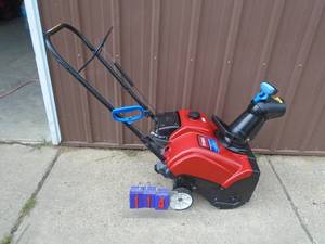 lot 114 image: 4 cycle Toro Power Clear snow thrower. Electric start. Nice shape. As shown.