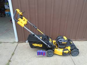 New Dewalt 20 volt lawn mower with bagger & charger. No batteries. *THIS ITEM HAS A RESERVE.