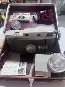 lot 72 image: Vintage Polaroid Land Camera The 800 Model wLeather Case, Accessories and Wink-Light