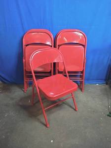 lot 70 image: 7 Red Folding Chairs