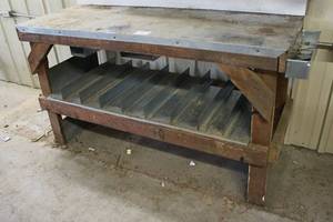 lot 5 image: Heavy Duty Metal and Wood Workbench with Multi-Slot Storage Shelf