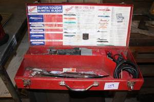 lot 29 image: Milwaukee Heavy Duty Sawzall Reciprocating Saw with Metal Case and Blades
