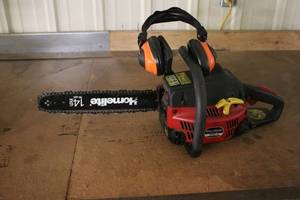 lot 38 image: Homelite 14-Inch Chainsaw with Ear Protection