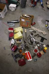 lot 59 image: Assorted Trailer Parts and Hardware Lot with Lights, Hooks, and Accessories