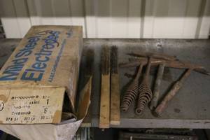 lot 74 image: Welding Supplies Lot with Mild Steel Electrodes, Wire Brushes, and Chipping Hammers