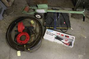 lot 75 image: Plasplugs Tile Cutter, Drain Cleaner Snake, Rolling Sprayer, and Hose Lot