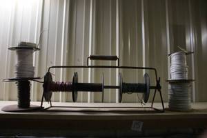 lot 77 image: Spool Holder Rack with Assorted Wire Spools