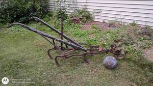 lot 117 image: Vintage walk behind plow cultivator & penny bowling ball